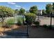 Community pool area with surrounding greenery and a bicycle rack in the foreground at 8850 Grappe Trace, Suwanee, GA 30024