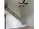 Spacious living room featuring high ceilings and staircase with wood and iron banister at 8850 Grappe Trace, Suwanee, GA 30024