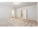 Large bedroom with neutral carpet and two doorways at 2111 Wesson Ct, Kennesaw, GA 30144