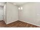 Dining area with modern chandelier and wood-look flooring next to back door at 2111 Wesson Ct, Kennesaw, GA 30144