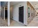 Inviting front entry featuring a black door and elegant stone accents at 2111 Wesson Ct, Kennesaw, GA 30144