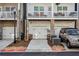 Townhome garages with brick pillars and driveway at 2111 Wesson Ct, Kennesaw, GA 30144