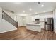 Open-concept living area featuring a modern kitchen with stainless steel appliances and a large island at 2111 Wesson Ct, Kennesaw, GA 30144