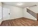 Bright living room with wood flooring and a staircase to the upper level at 2111 Wesson Ct, Kennesaw, GA 30144