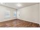 Spacious living area featuring wood-look flooring and a large window at 2111 Wesson Ct, Kennesaw, GA 30144