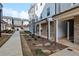 A paved walkway leads to townhomes with maintained landscaping in a Gathering-friendly neighborhood at 2111 Wesson Ct, Kennesaw, GA 30144