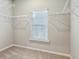 Walk-in closet with wire shelving and a window for natural light at 2111 Wesson Ct, Kennesaw, GA 30144
