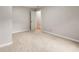 Neutral bedroom showcasing plush carpeting and a view into the hallway at 2828 Cloverhurst Dr, Atlanta, GA 30344
