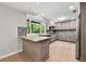 Modern kitchen with stainless steel appliances, a breakfast bar and outdoor views at 2828 Cloverhurst Dr, Atlanta, GA 30344