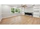 Bright living room boasting a ceiling fan, hardwood floors, and a marble fireplace at 2828 Cloverhurst Dr, Atlanta, GA 30344