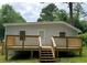Backyard featuring a wooden deck, steps down to the grassy yard, and the back of the house at 2346 Pryor Sw Rd, Atlanta, GA 30315