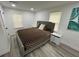 This bedroom features neutral walls, plank flooring, and a comfortable bed at 2346 Pryor Sw Rd, Atlanta, GA 30315
