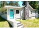 Charming home with a vibrant blue door, stone chimney and well-manicured lawn at 2346 Pryor Sw Rd, Atlanta, GA 30315
