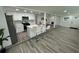 Modern kitchen featuring stainless steel appliances, quartz countertops, and breakfast bar seating at 2346 Pryor Sw Rd, Atlanta, GA 30315