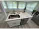 Modern kitchen island with sink, dishwasher and quartz countertop with seating at 2346 Pryor Sw Rd, Atlanta, GA 30315