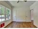 Bedroom with hardwood floors, large window, and neutral paint at 3599 Centerville Rosebud Rd, Snellville, GA 30039