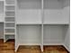 Spacious walk-in closet with built-in shelving and hardwood floors at 3599 Centerville Rosebud Rd, Snellville, GA 30039