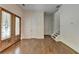Inviting entryway with hardwood floors, decorative glass door, and access to the upper level at 3599 Centerville Rosebud Rd, Snellville, GA 30039
