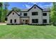 Charming two-story home boasts a brick facade, black accents, and a well-manicured lawn at 3599 Centerville Rosebud Rd, Snellville, GA 30039