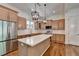 Lovely kitchen featuring a center island, wood cabinets, and stainless steel appliances at 3599 Centerville Rosebud Rd, Snellville, GA 30039