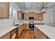 Classic kitchen features stainless steel appliances, wood cabinets, and quartz counters at 3599 Centerville Rosebud Rd, Snellville, GA 30039