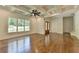 Inviting living room features hardwood floors, large windows, and an adjacent entryway and staircase at 3599 Centerville Rosebud Rd, Snellville, GA 30039