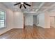Spacious living room features hardwood floors, recessed lighting, and an adjacent entryway and staircase at 3599 Centerville Rosebud Rd, Snellville, GA 30039