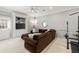 Basement with a sectional, a tv, and gym equipment at 3640 Ridgeway Ter, Suwanee, GA 30024