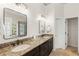 Bathroom featuring double sinks, granite countertops and elegant fixtures at 3640 Ridgeway Ter, Suwanee, GA 30024