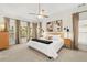Spacious bedroom featuring a neutral color palette, carpeted floor, and natural lighting at 3640 Ridgeway Ter, Suwanee, GA 30024