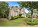 Spacious suburban home with large front lawn, manicured bushes and trees, and an attached garage at 3640 Ridgeway Ter, Suwanee, GA 30024