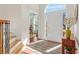 Bright foyer with gleaming hardwood floors, a staircase, and a view into the adjacent room at 3640 Ridgeway Ter, Suwanee, GA 30024