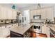 Well-equipped kitchen with stainless steel appliances, light-colored cabinets, and granite countertops at 3640 Ridgeway Ter, Suwanee, GA 30024