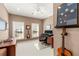 Home office space boasts dual monitors, stylish decor, and plenty of natural light at 3640 Ridgeway Ter, Suwanee, GA 30024