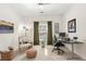 Bright home office with desk, comfortable chair, and ample natural light at 3640 Ridgeway Ter, Suwanee, GA 30024