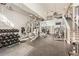 Well-equipped gym with weights, machines, mirrors, and a staircase to a second level at 3777 Peachtree Ne Rd # 1335, Atlanta, GA 30319