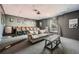 Comfortable home theater featuring a sofa, movie chairs, a projector, and movie posters at 3777 Peachtree Ne Rd # 1335, Atlanta, GA 30319
