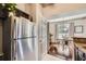 Efficient kitchen with stainless steel fridge and view to dining area at 3777 Peachtree Ne Rd # 1335, Atlanta, GA 30319