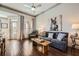 Inviting living room featuring hardwood floors, a ceiling fan, and comfortable seating at 3777 Peachtree Ne Rd # 1335, Atlanta, GA 30319