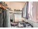 Organized walk-in closet with shelves and rods filled with clothing, shoes, and accessories at 3777 Peachtree Ne Rd # 1335, Atlanta, GA 30319