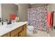 Traditional bathroom with a vanity and a shower-tub combination with a patterned curtain at 3798 Kirkwood Nw Run, Kennesaw, GA 30144