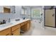A well-lit bathroom with double sinks, soaking tub, and a separate shower, offering a relaxing and functional space at 3798 Kirkwood Nw Run, Kennesaw, GA 30144