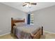 Cozy bedroom featuring a wooden bed frame and a window providing natural light at 3798 Kirkwood Nw Run, Kennesaw, GA 30144