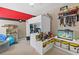 A quirky bedroom that includes a loft bed, study area, shelves and themed decorations at 3798 Kirkwood Nw Run, Kennesaw, GA 30144