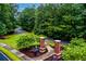 Stone and brick entryway with mature landscaping and well-maintained gardens at 3798 Kirkwood Nw Run, Kennesaw, GA 30144