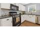 Updated kitchen featuring white cabinets, stainless steel appliances, and granite countertops at 3798 Kirkwood Nw Run, Kennesaw, GA 30144