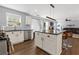 Open concept kitchen showcases island with seating, stainless appliances, and seamless flow to living area at 3798 Kirkwood Nw Run, Kennesaw, GA 30144
