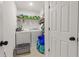 A well-organized laundry room with washer, dryer, shelving and storage space, designed for efficient laundry tasks at 3798 Kirkwood Nw Run, Kennesaw, GA 30144