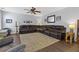 Expansive living room offers ample seating with a large sectional sofa and ceiling fan at 3798 Kirkwood Nw Run, Kennesaw, GA 30144
