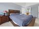Spacious Primary bedroom featuring a comfortable bed, side tables, and a serene atmosphere perfect for relaxation at 3798 Kirkwood Nw Run, Kennesaw, GA 30144